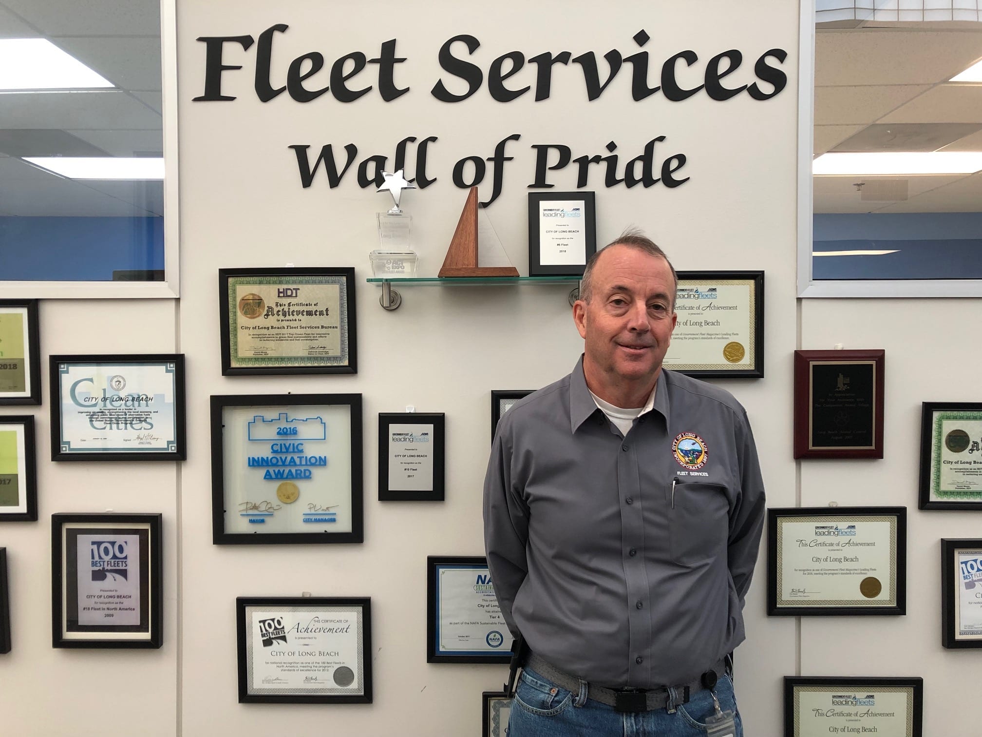 Dan Berlenbach Stands at Fleet Services Wall of Pride