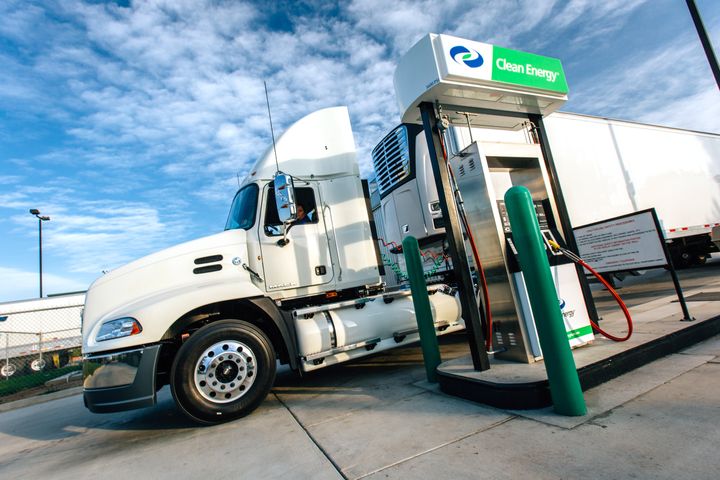 white semi truck fueling at CNG station