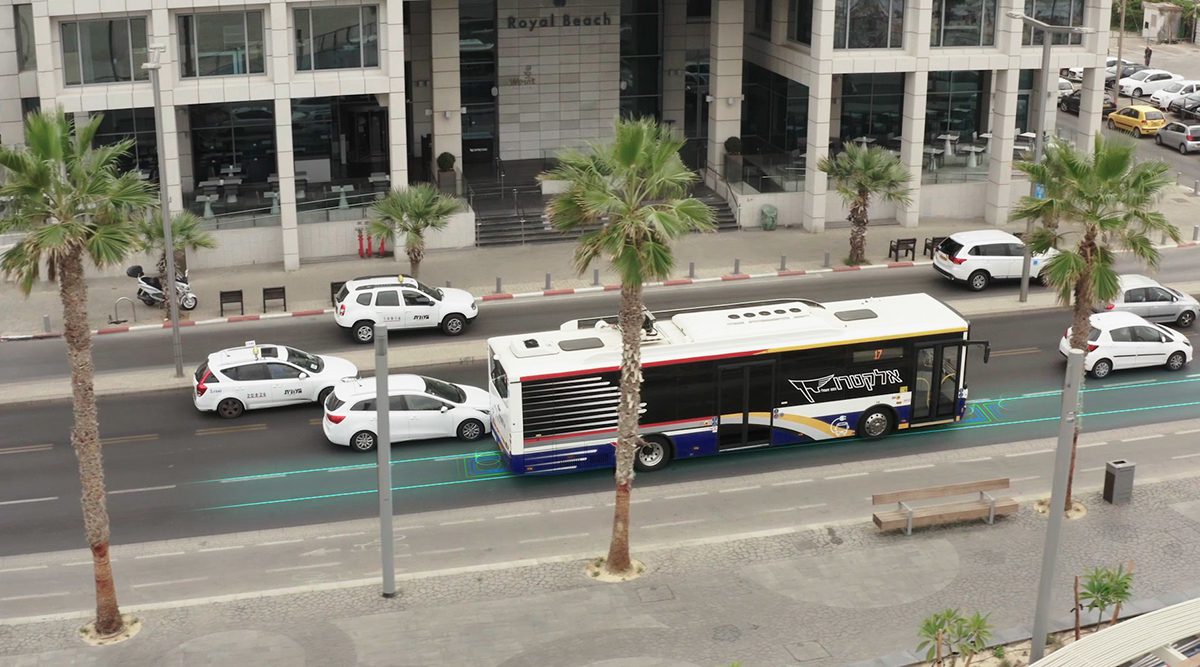 battery electric bus on road that charges vehicles